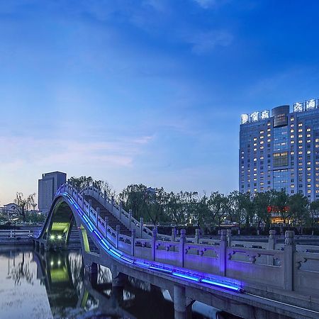 เฟยเชง บลอสซัม โอเต็ล Hotel Feicheng ภายนอก รูปภาพ