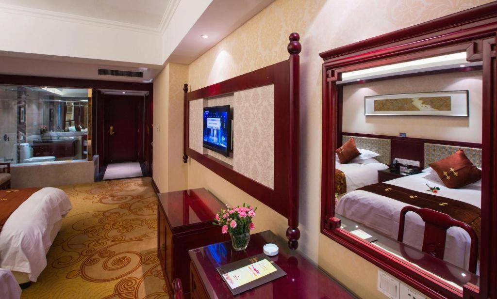 เฟยเชง บลอสซัม โอเต็ล Hotel Feicheng ภายนอก รูปภาพ