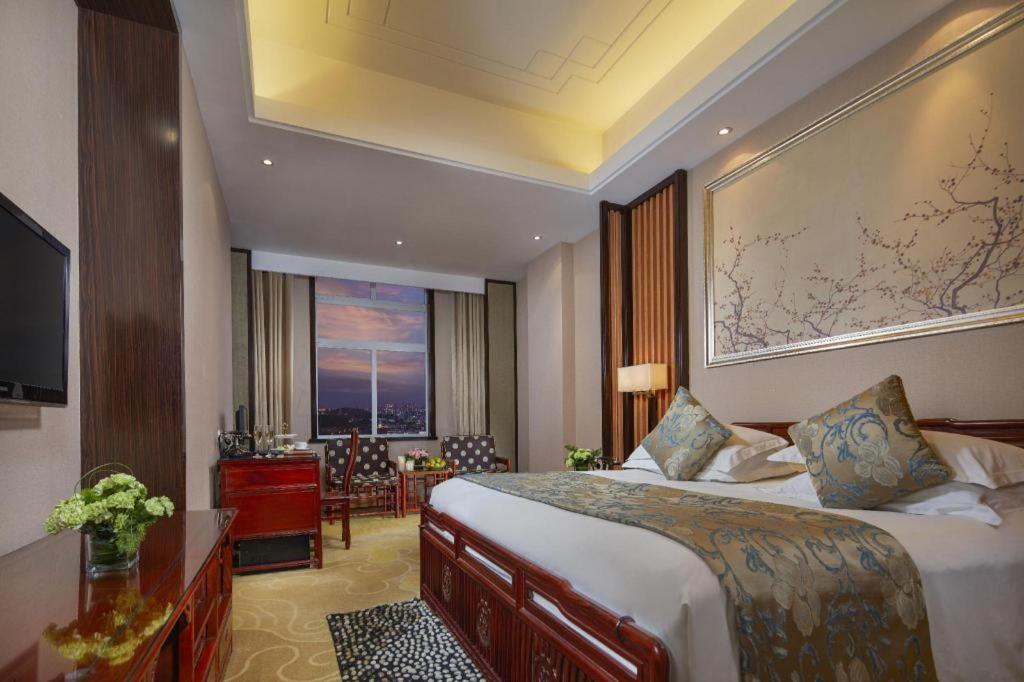 เฟยเชง บลอสซัม โอเต็ล Hotel Feicheng ภายนอก รูปภาพ
