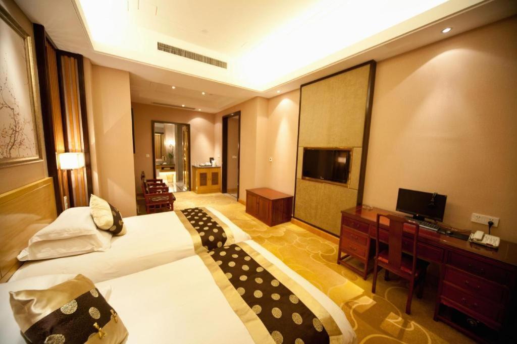 เฟยเชง บลอสซัม โอเต็ล Hotel Feicheng ภายนอก รูปภาพ