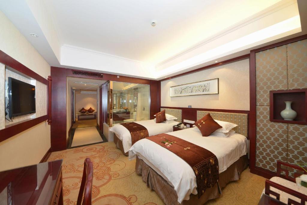 เฟยเชง บลอสซัม โอเต็ล Hotel Feicheng ภายนอก รูปภาพ