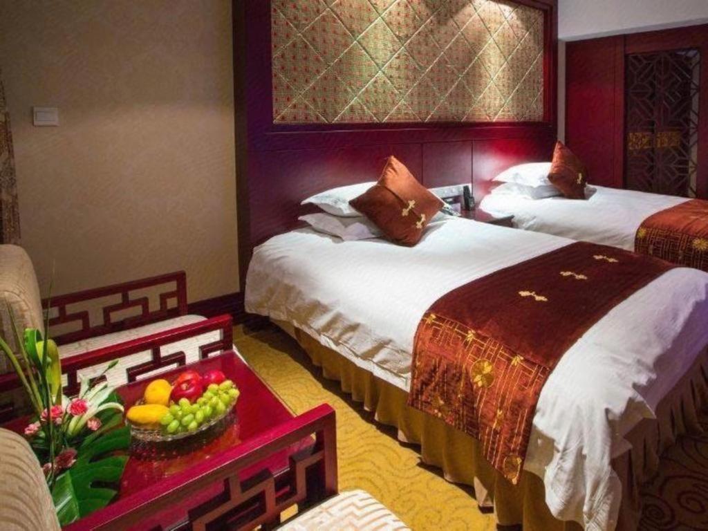 เฟยเชง บลอสซัม โอเต็ล Hotel Feicheng ภายนอก รูปภาพ
