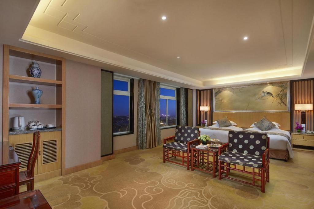 เฟยเชง บลอสซัม โอเต็ล Hotel Feicheng ภายนอก รูปภาพ