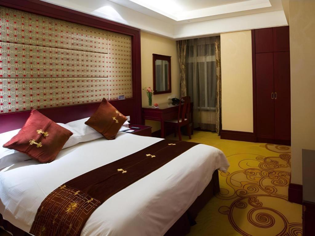 เฟยเชง บลอสซัม โอเต็ล Hotel Feicheng ภายนอก รูปภาพ