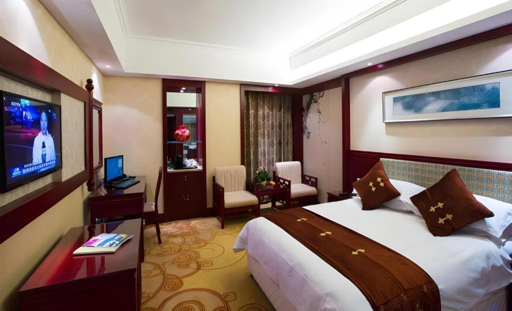 เฟยเชง บลอสซัม โอเต็ล Hotel Feicheng ภายนอก รูปภาพ