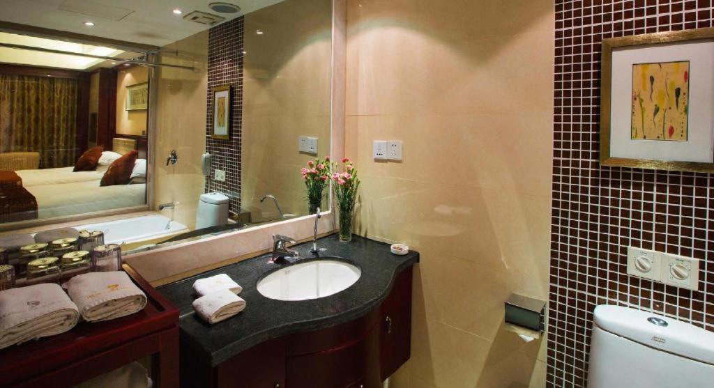 เฟยเชง บลอสซัม โอเต็ล Hotel Feicheng ภายนอก รูปภาพ