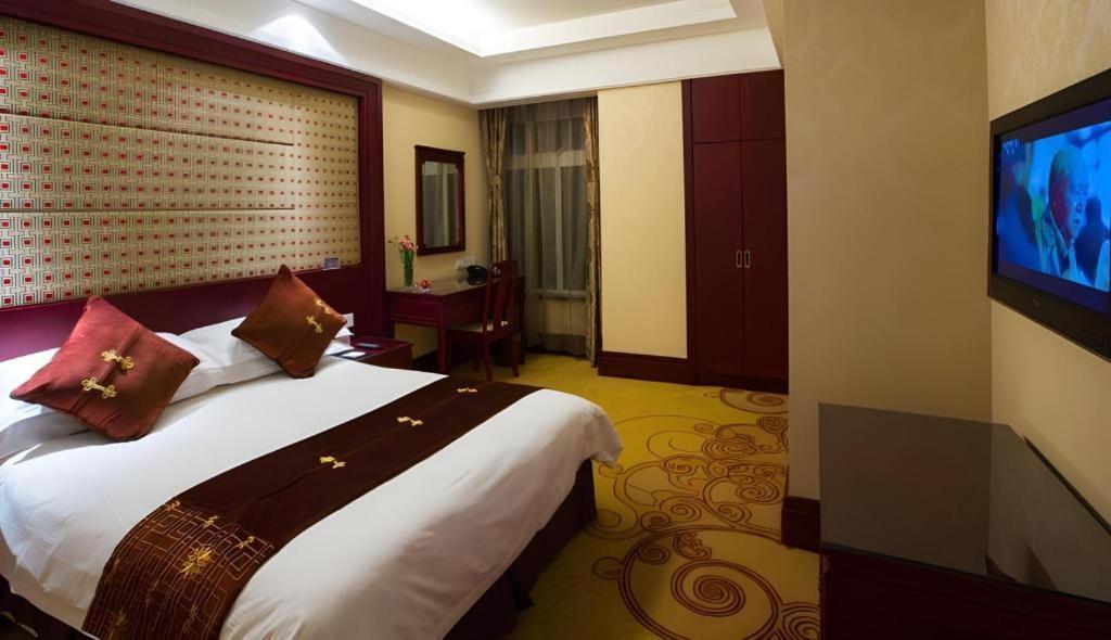 เฟยเชง บลอสซัม โอเต็ล Hotel Feicheng ภายนอก รูปภาพ