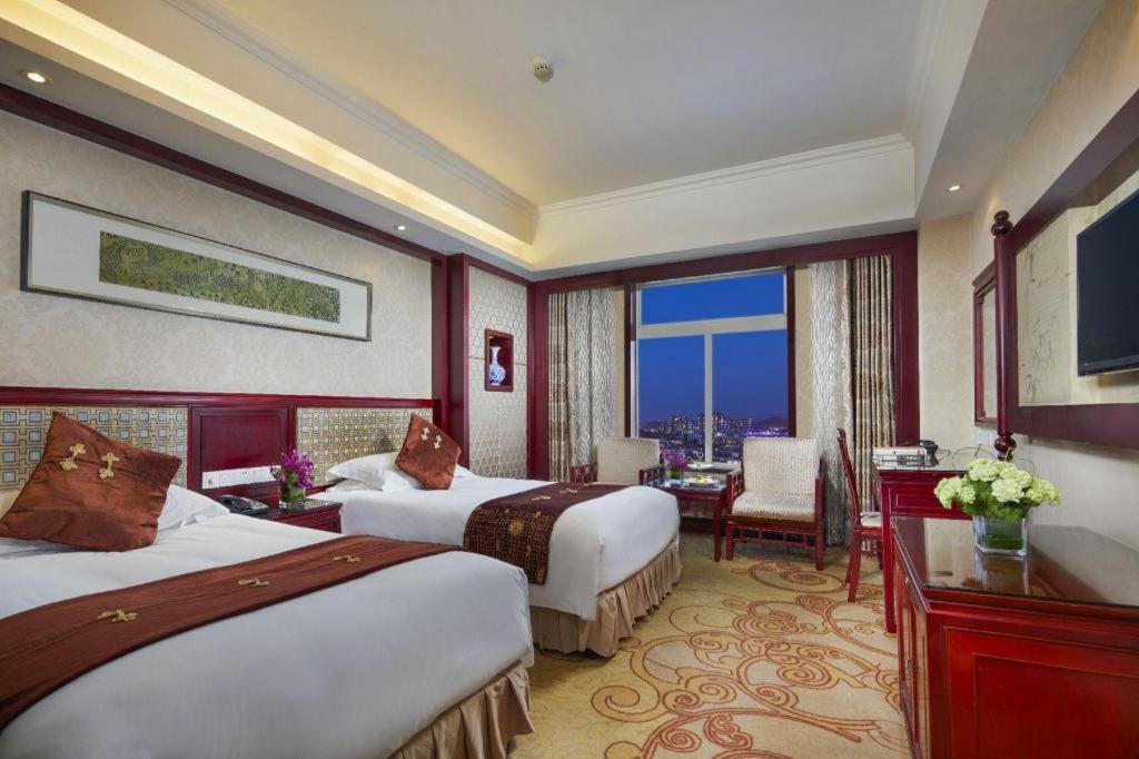 เฟยเชง บลอสซัม โอเต็ล Hotel Feicheng ภายนอก รูปภาพ