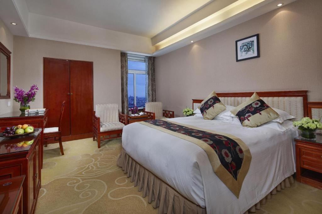 เฟยเชง บลอสซัม โอเต็ล Hotel Feicheng ภายนอก รูปภาพ