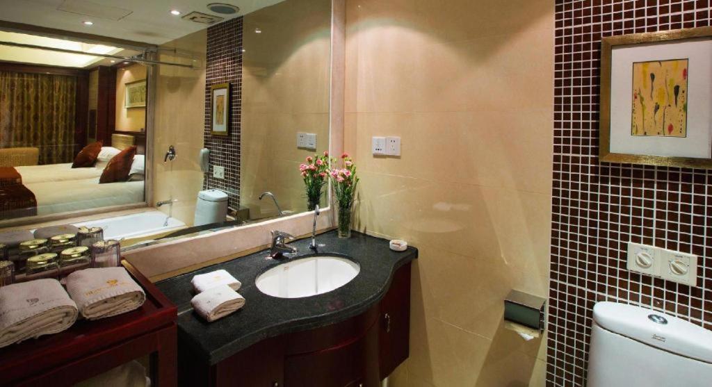 เฟยเชง บลอสซัม โอเต็ล Hotel Feicheng ภายนอก รูปภาพ